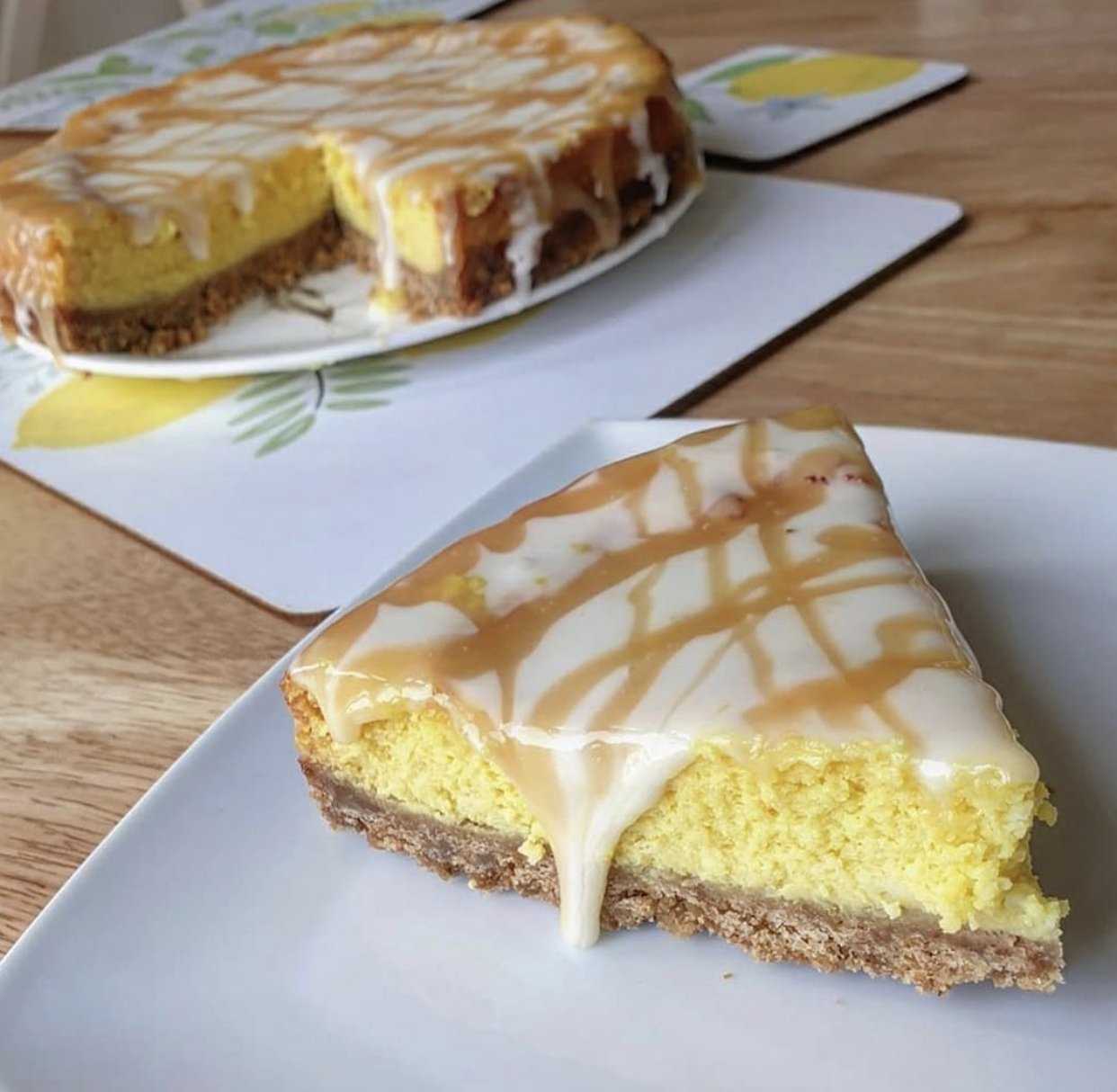 Low fat lemon drizzle cheesecake slice on a plate